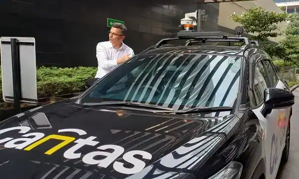 Autonomous vehicle equipped with sensors and cameras for MLFF toll system testing.